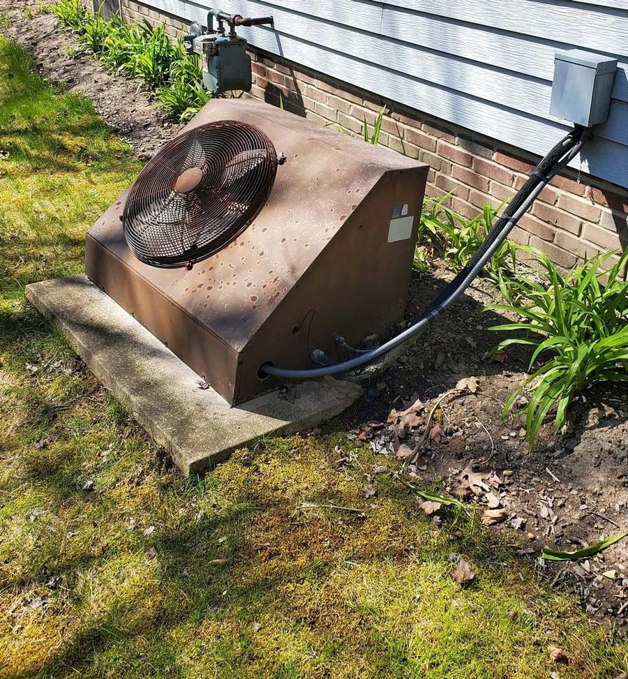 Old corroded AC unit before IKAD replaced it