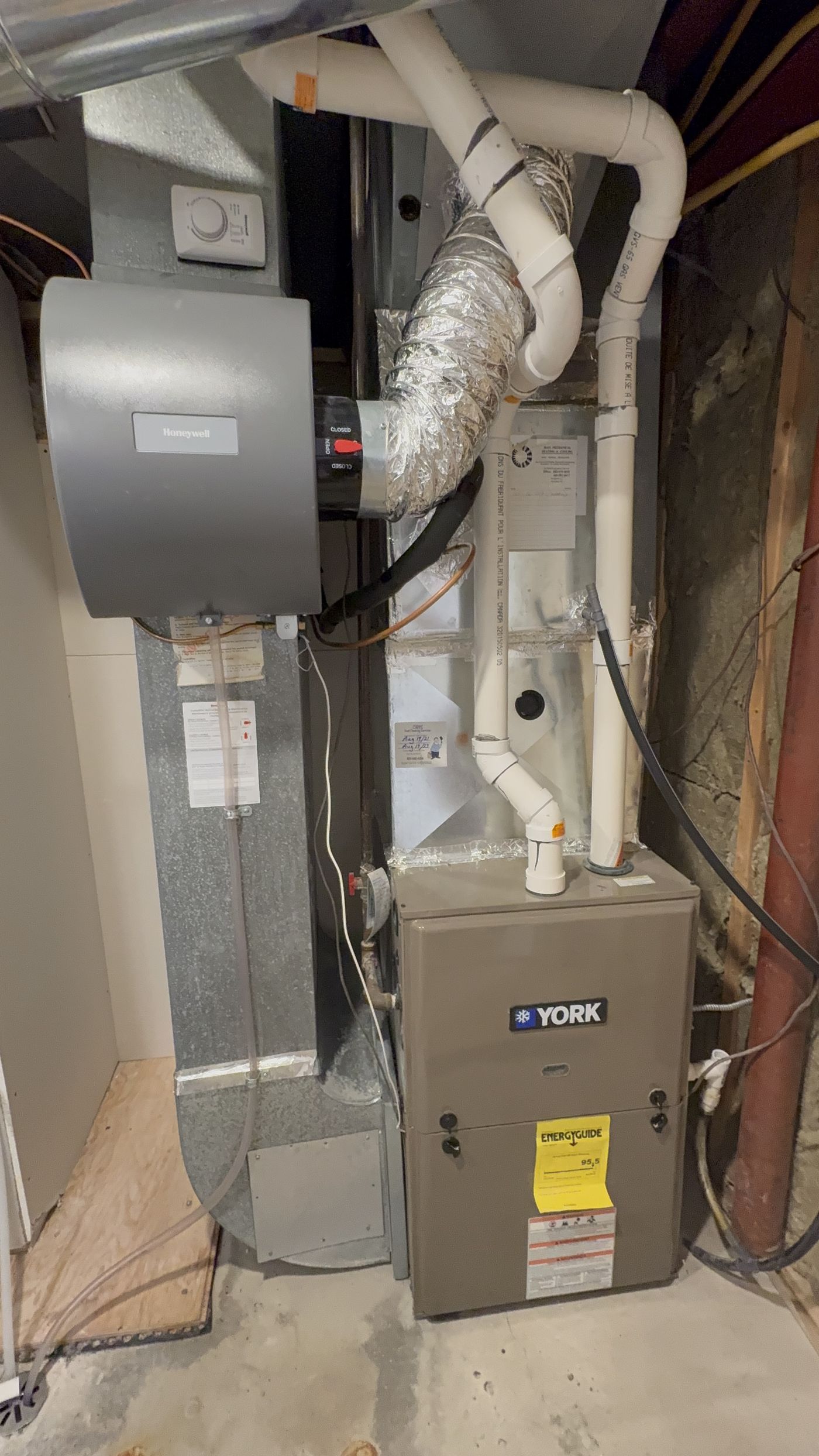 High-efficiency York furnace with Honeywell humidifier installed in an Oakville basement by IKAD Mechanical